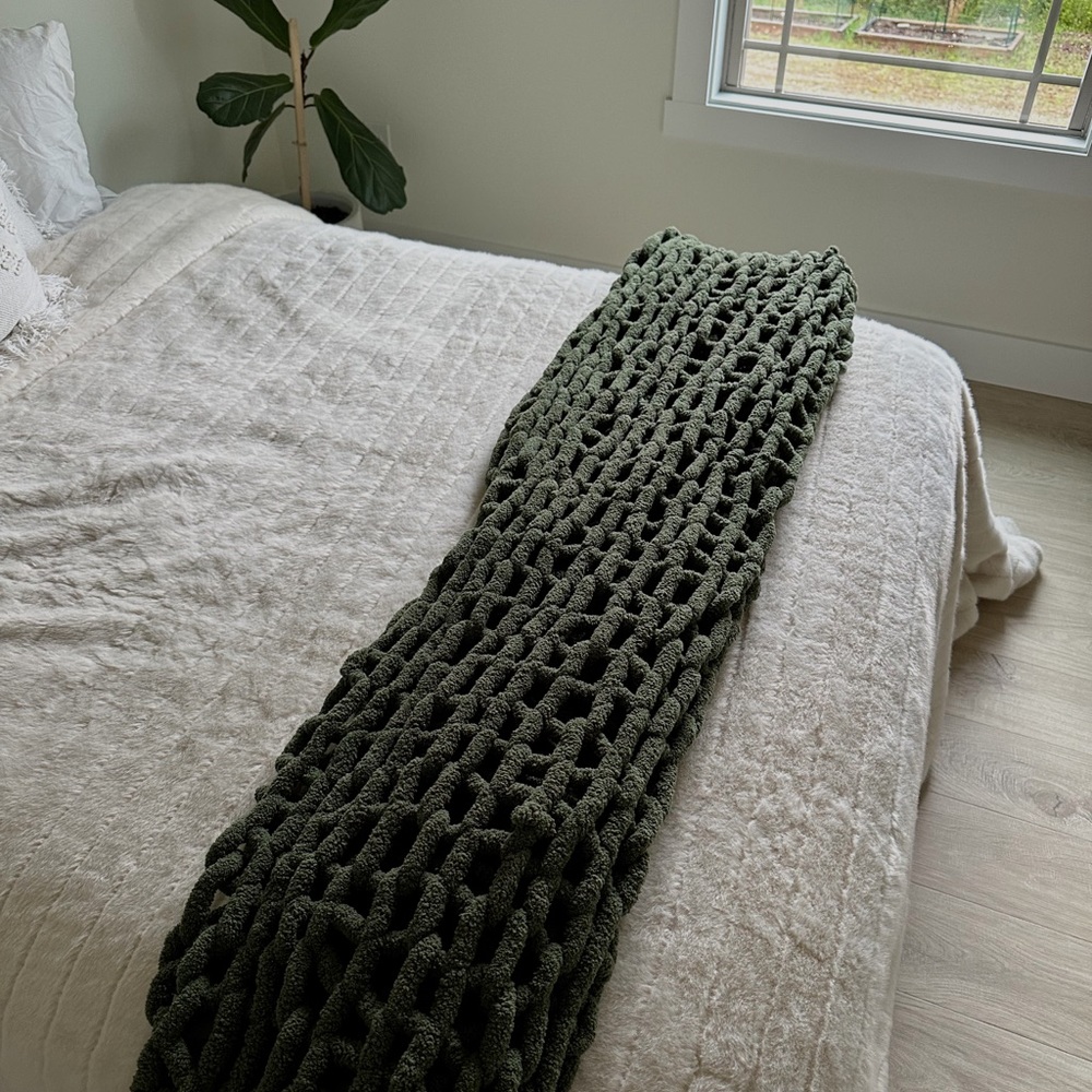 Dark green chunky knit blanket